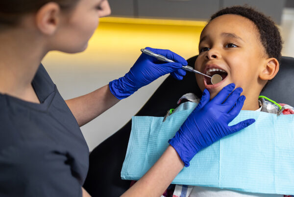 Insurance by Industry - Dentist Giving a Boy a Dental Exam During an Appointment